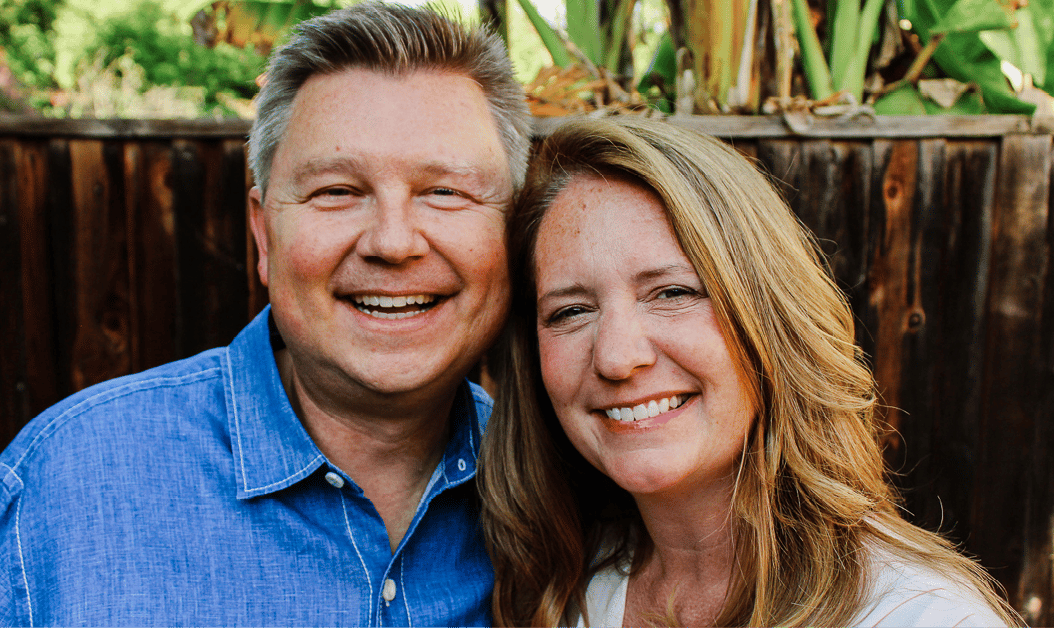 A head shot of Steve Bundy and Melissa standing together and smiling at the camera.